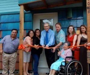 Team members of Austin Community Design & Development Center (ACDDC) and community during ribbon cutting ceremony