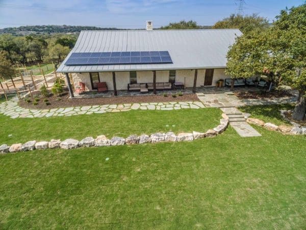 House garden view and roof with solar panels installed in Boerne, Texas