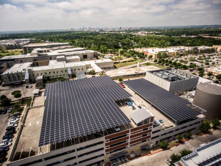 Strictly Pediatrics Surgery Center Building in Austin, Texas with array of solar panels on top floor of the parking garage
