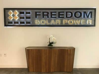 Freedom Solar Power sign on wall