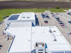 Roof view with solar panels installed of covert Ford dealership in Central Texas