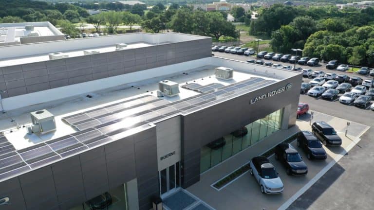 Close up view of solar panels installed on roof of Land Rover Dealer in Boerne, Texas