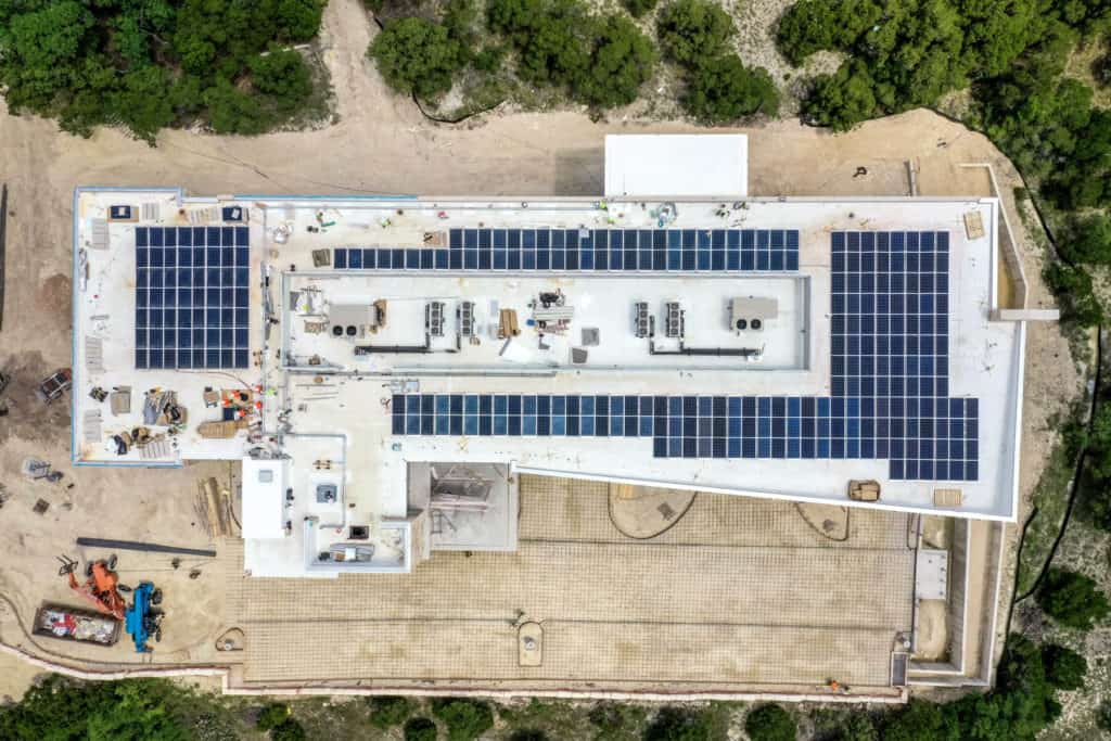 Aerial photo of commercial building with solar panels