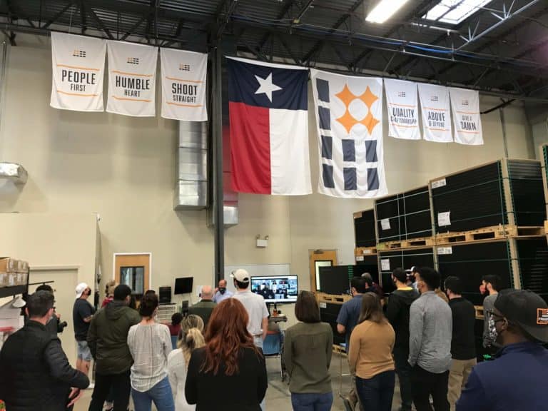 Freedom Solar's team during meeting inside the warehouse