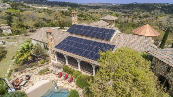 Aerial photo of house with solar panels on roof