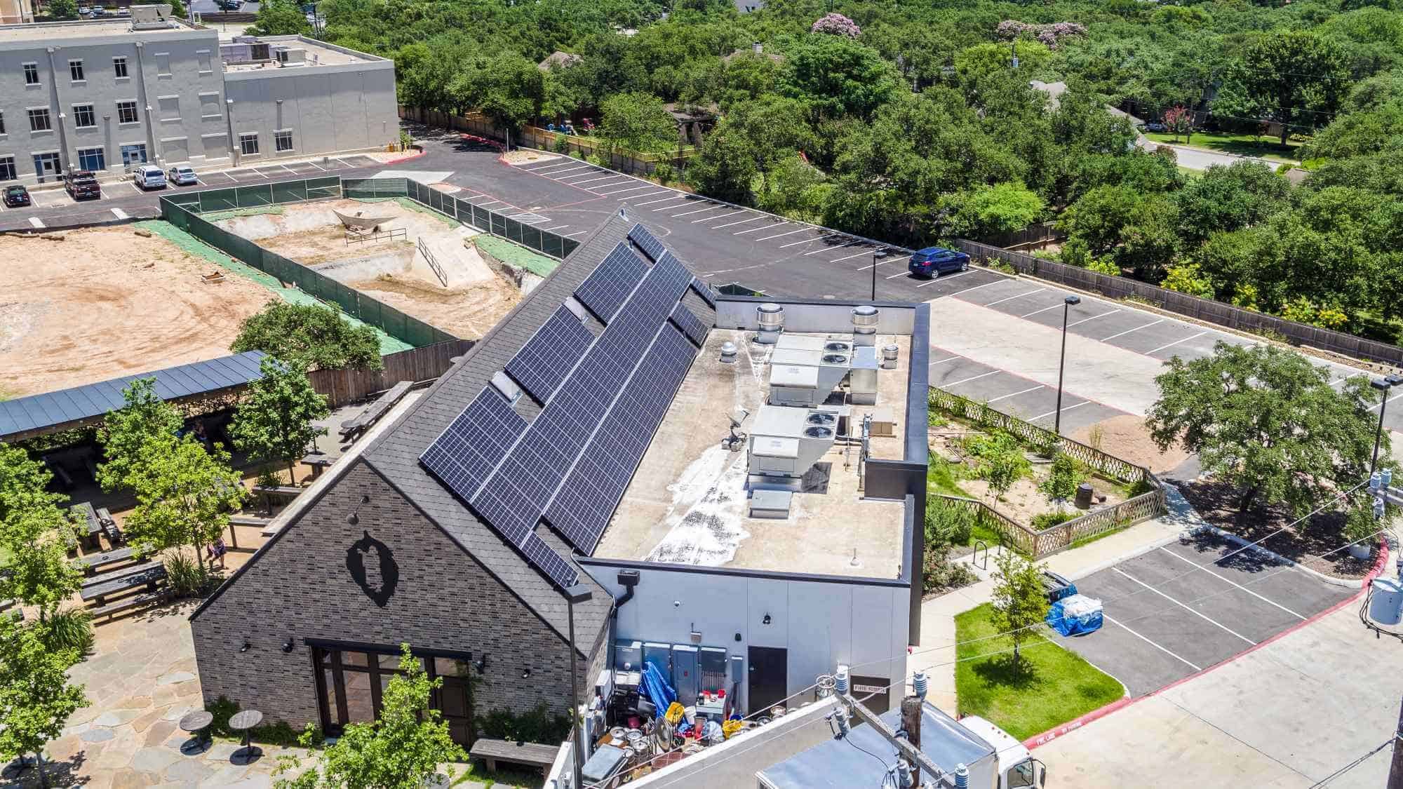 Aerial view of Hoppy Monk restaurant in San Antonio, Texas with solar panels installed on the roof