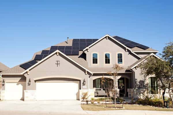 Front view of house with solar panels installed on roof in San Antonio, Texas