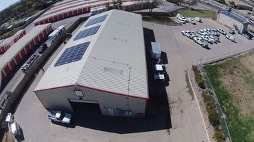 Drone view of roof of ABC Home & Commercial Services in San Antonio, Texas with solar panels