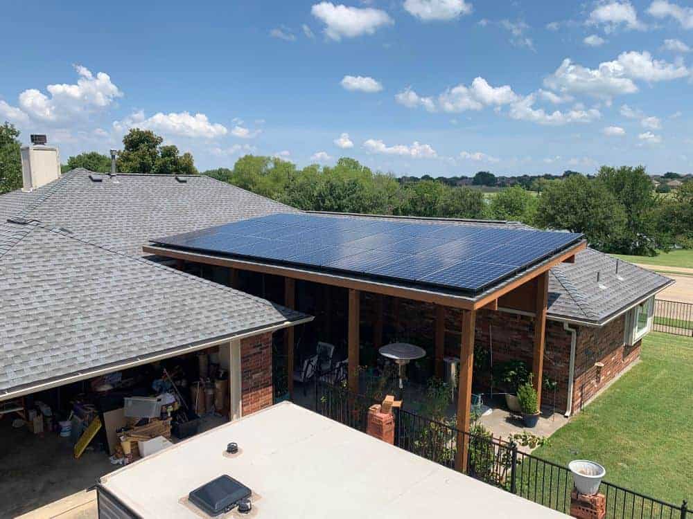 Lateral view of house with solar panels on roof in Rockwall, Texas