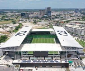 Aerial view of Q2 stadium in Austin, Texas with solar panels installed on the roof