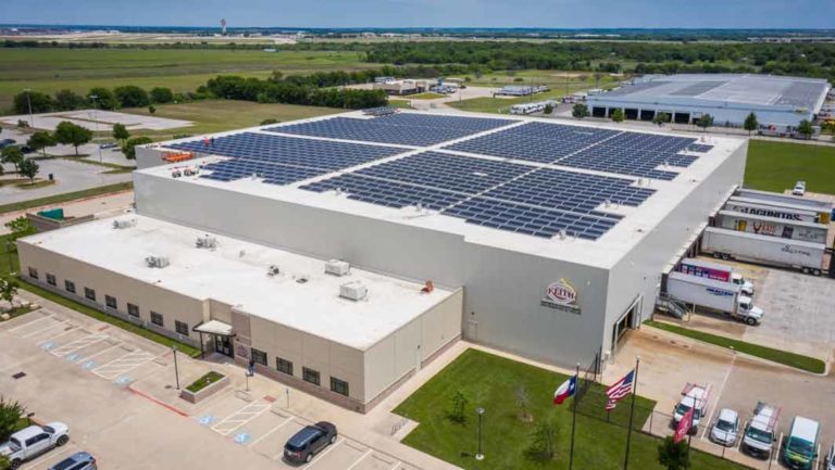 General view of Ben E. Keith Company building in Fort Worth, Texas with array of solar panels installed on the roof