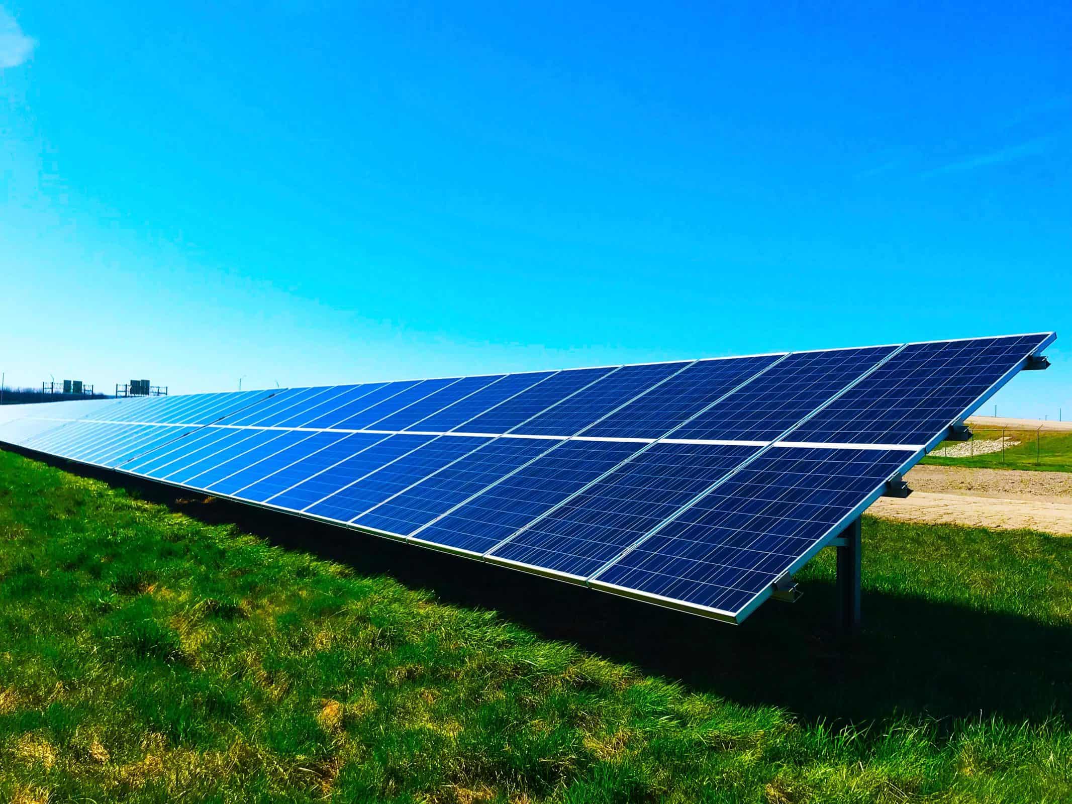 Solar panels in a grassy field