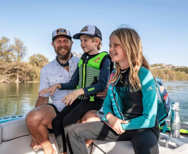 Freedom Solar CEO Bret Biggart and kids on a boat