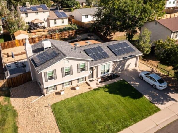 Top view of house with solar panels on the roof, in a residential area of Aurora, Denver