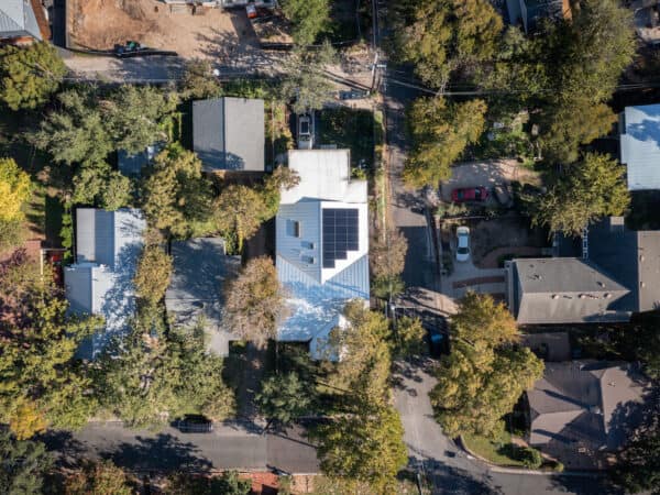 Top view of house with solar panels on the roof, in a residential area of Austin, Texas