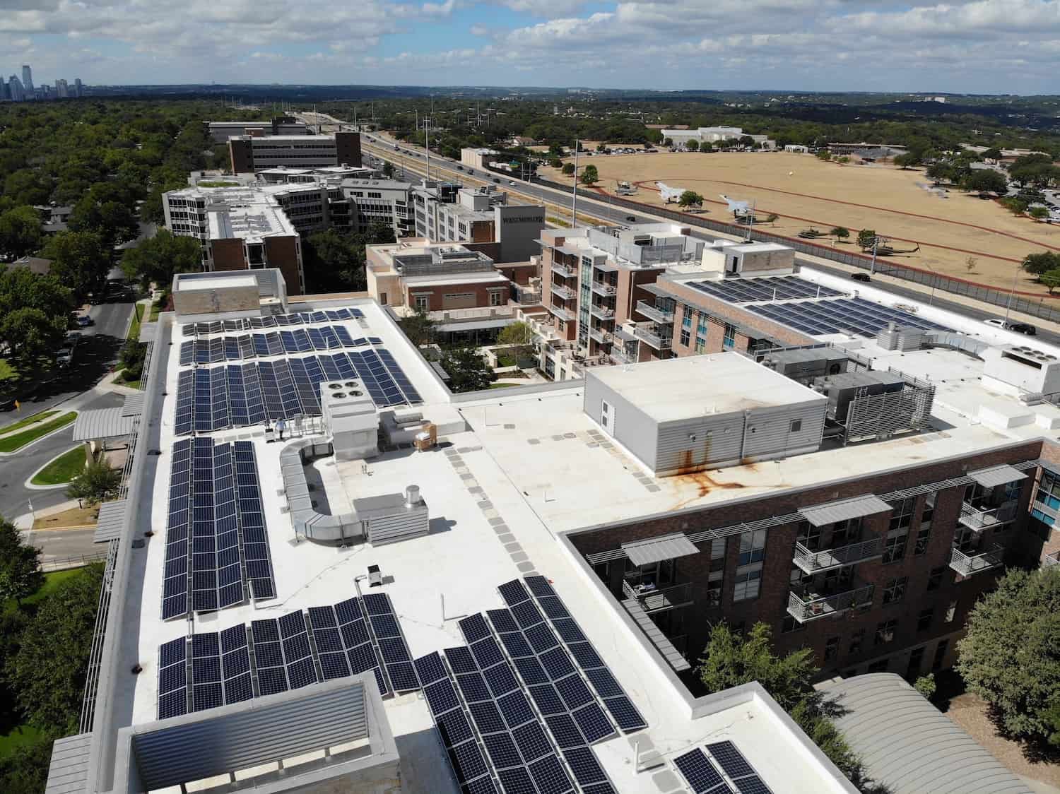Multifamily And Assisted Living roof in Westminster, Austin, Texas with solar panels installed and Texas Military Department on the side