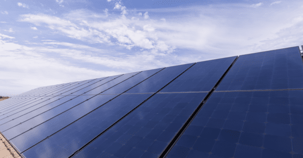 Solar panel array with blue sky in background