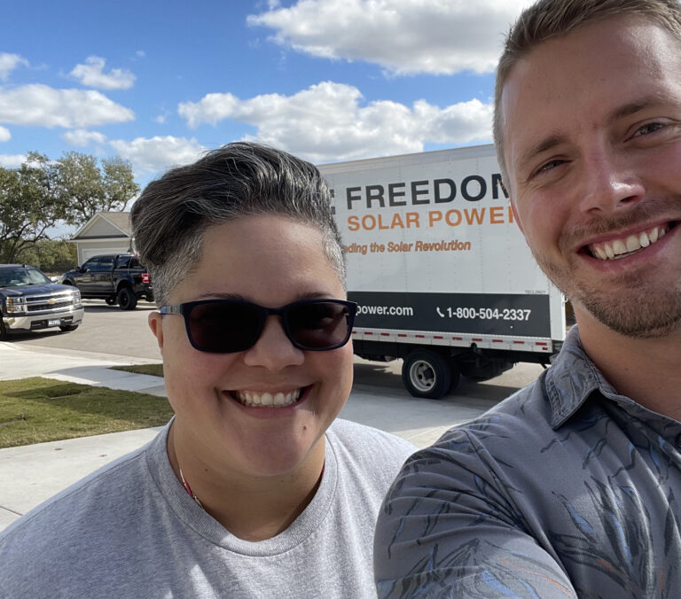 Customer in Front of Freedom Solar Truck