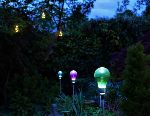 Solar powered lights at dusk in a garden