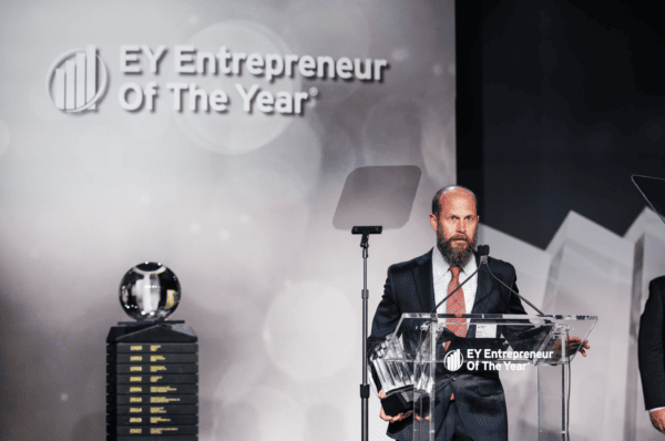 Brett Biggart, Freedom Solar's CEO, receiving Entrepreneur Of The Year® award (2023) by EY