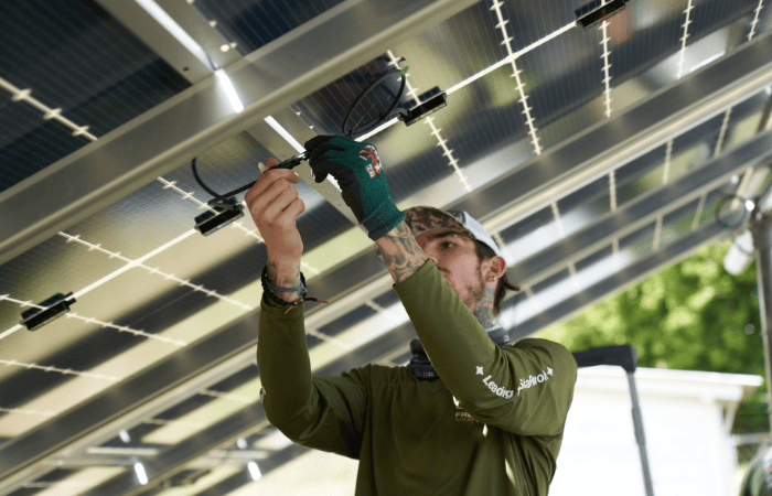 Guy fixing solar panel in florida
