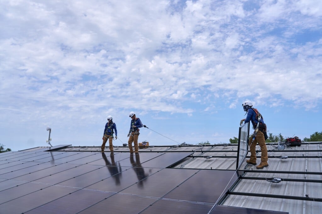 Solar Install Crew on Todd White's Roof Laying Down Panels